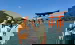 Travellers stood in front of the Itsukushima Shrine