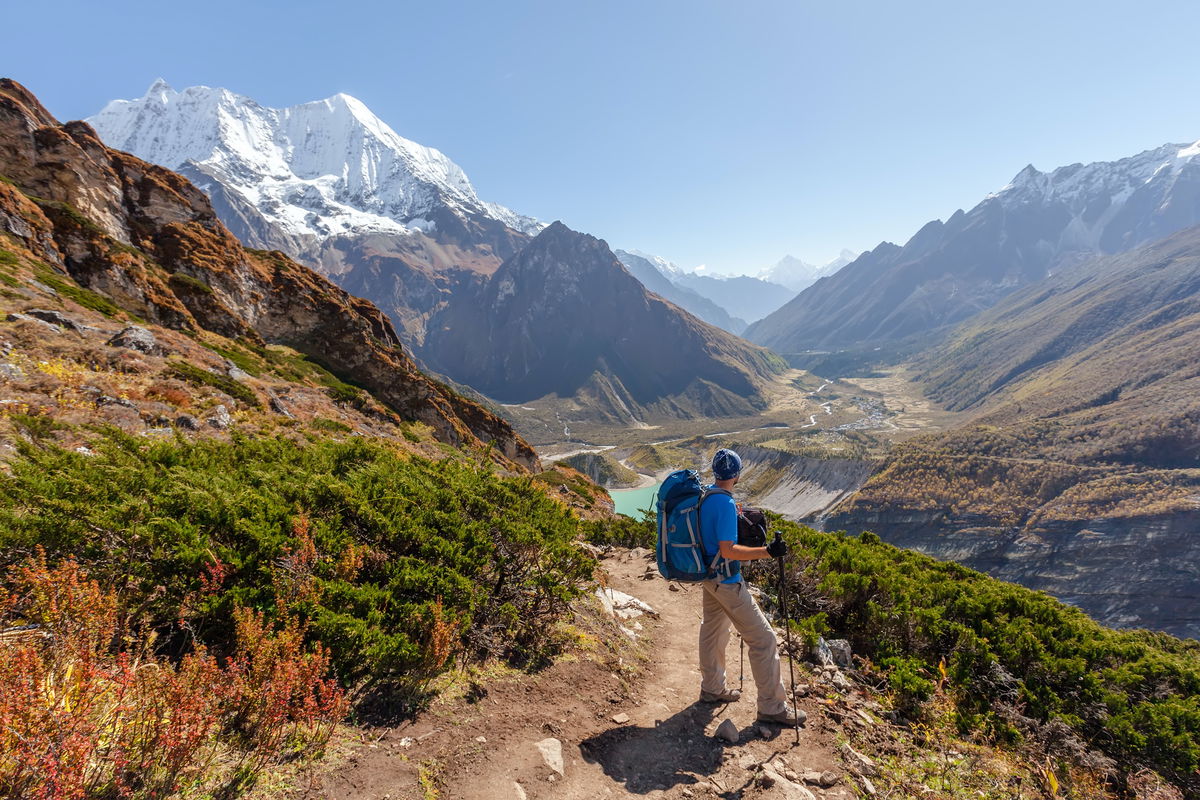 Person hiking in a mountain range in Nepal