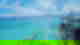 Traditional Filipino boat sailing through bright turquoise waters with a cloudy blue sky in the distance