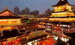 Night view of neon-lit buildings around Shanghai City God Temple