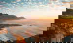 Aerial view of Cape Town, beaches and surrounding mountains at sunset