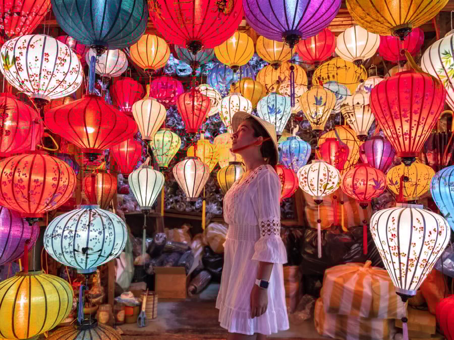 Traveller looking at lanterns in Vietnam
