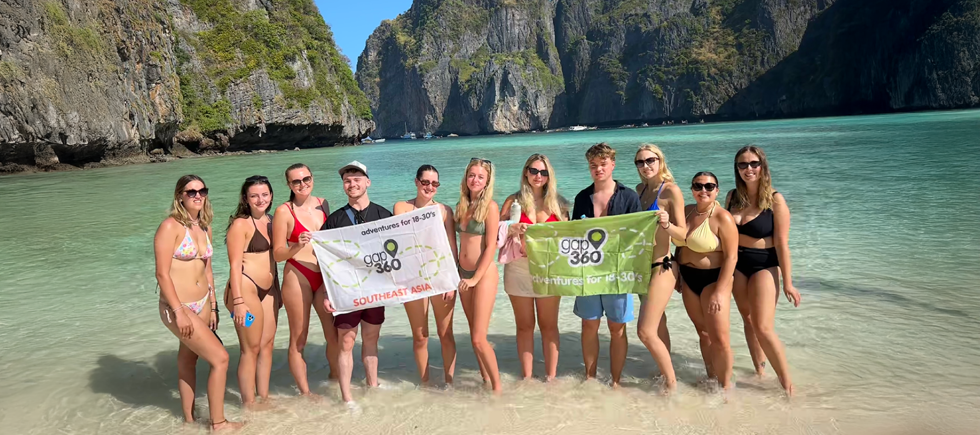 Group of people on the beach dancing